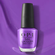 OPI nail polish bottle on a purple background